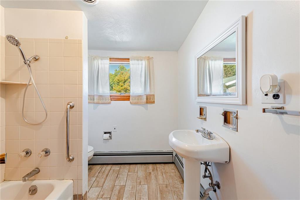 1598 Keystone Park Road New Alexandria, PA 15670 - Photo 12 of 28 a bathroom with a sink a toilet and shower