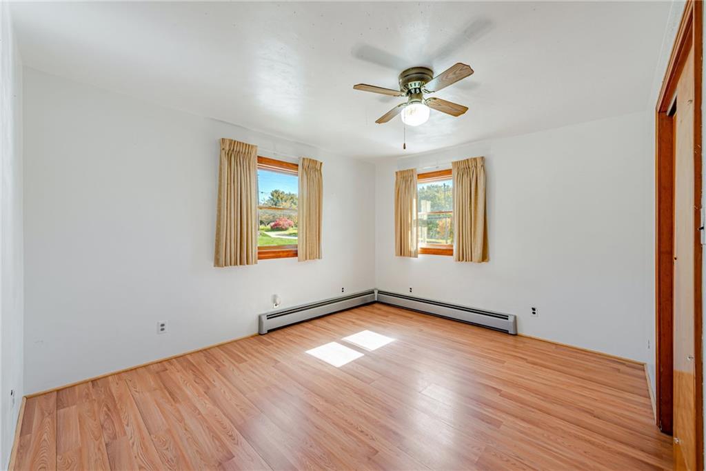 1598 Keystone Park Road New Alexandria, PA 15670 - Photo 13 of 28 a view of an empty room with wooden floor and a window