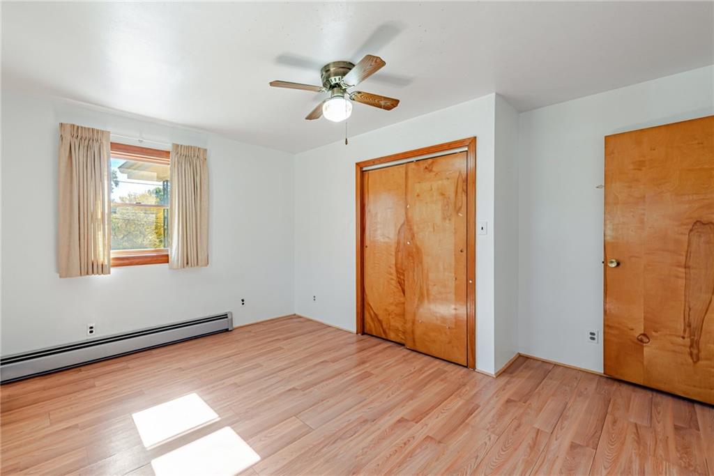 1598 Keystone Park Road New Alexandria, PA 15670 - Photo 14 of 28 a view of empty room with wooden floor and fan