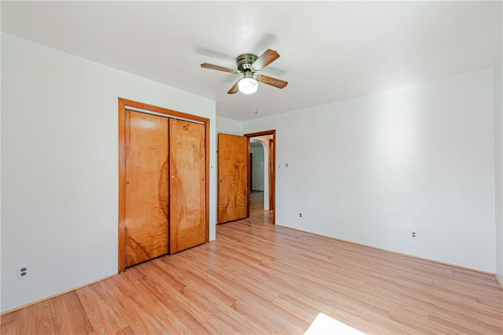 1598 Keystone Park Road New Alexandria, PA 15670 - Photo 15 of 28 an empty room with wooden floor closet and ceiling fan