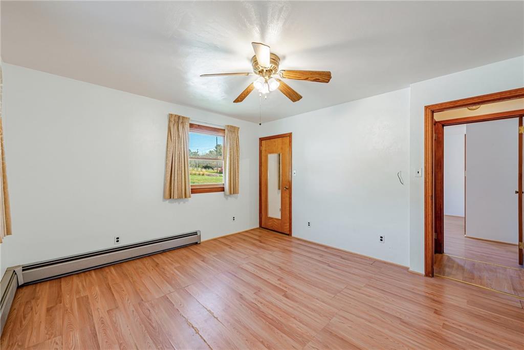 1598 Keystone Park Road New Alexandria, PA 15670 - Photo 17 of 28 an empty room with wooden floor chandelier fan and windows