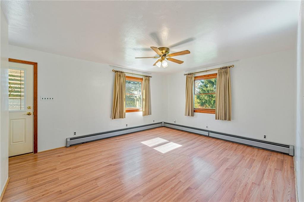 1598 Keystone Park Road New Alexandria, PA 15670 - Photo 3 of 28 an empty room with wooden floor and windows