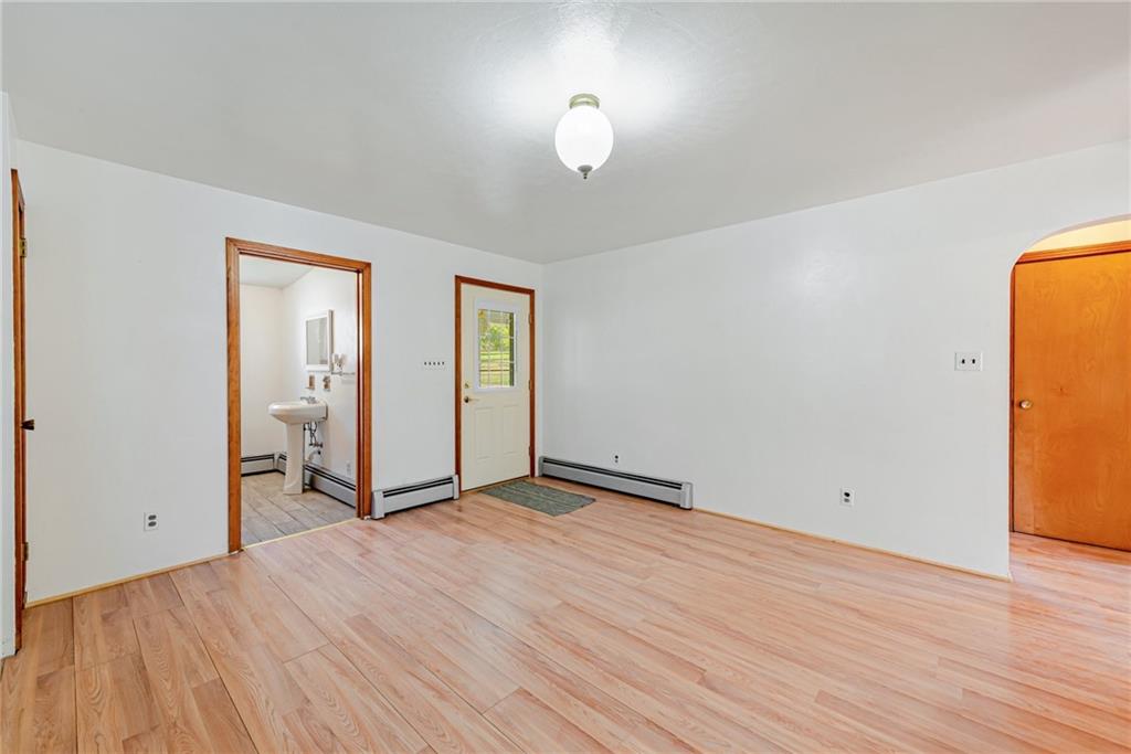 1598 Keystone Park Road New Alexandria, PA 15670 - Photo 7 of 28 an empty room with wooden floor and windows