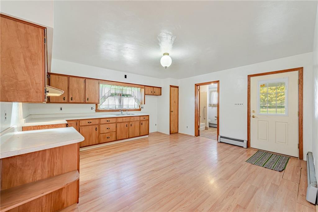 1598 Keystone Park Road New Alexandria, PA 15670 - Photo 8 of 28 a large kitchen with wooden floors and stainless steel appliances