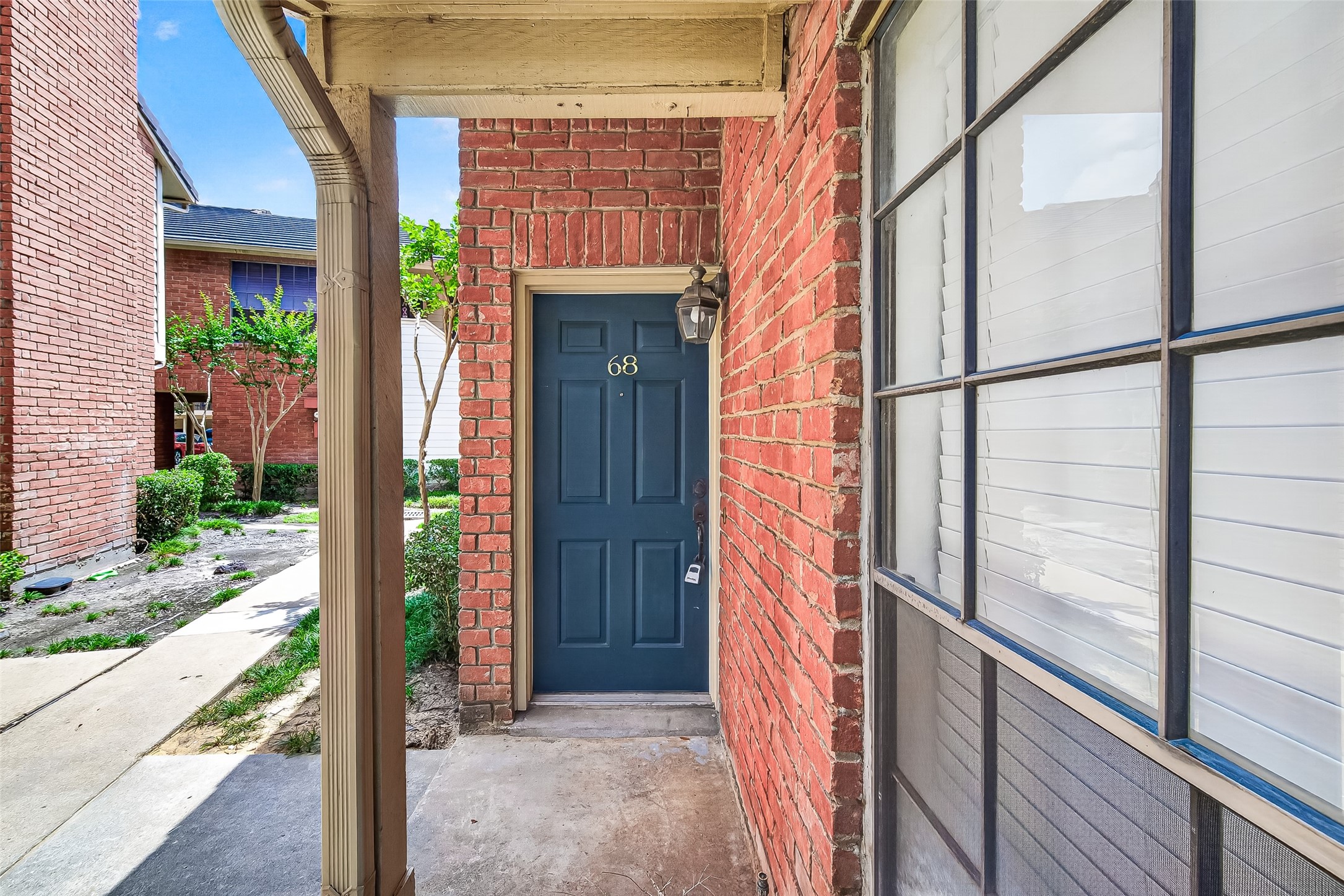 2211 South Kirkwood Road, Unit 68 Houston, TX 77077 - Photo 3 of 14 Charming two-story townhome featuring classic brick exterior and a private, enclosed patio for added outdoor living. This well-maintained home offers a functional layout with spacious living and dining areas, updated finishes, and abundant natural light throughout. The kitchen includes granite countertops, ample cabinetry, and a practical design perfect for everyday living. Upstairs, you’ll find comfortable bedrooms with generous closet space. Enjoy low-maintenance living with a cozy courtyard-style patio