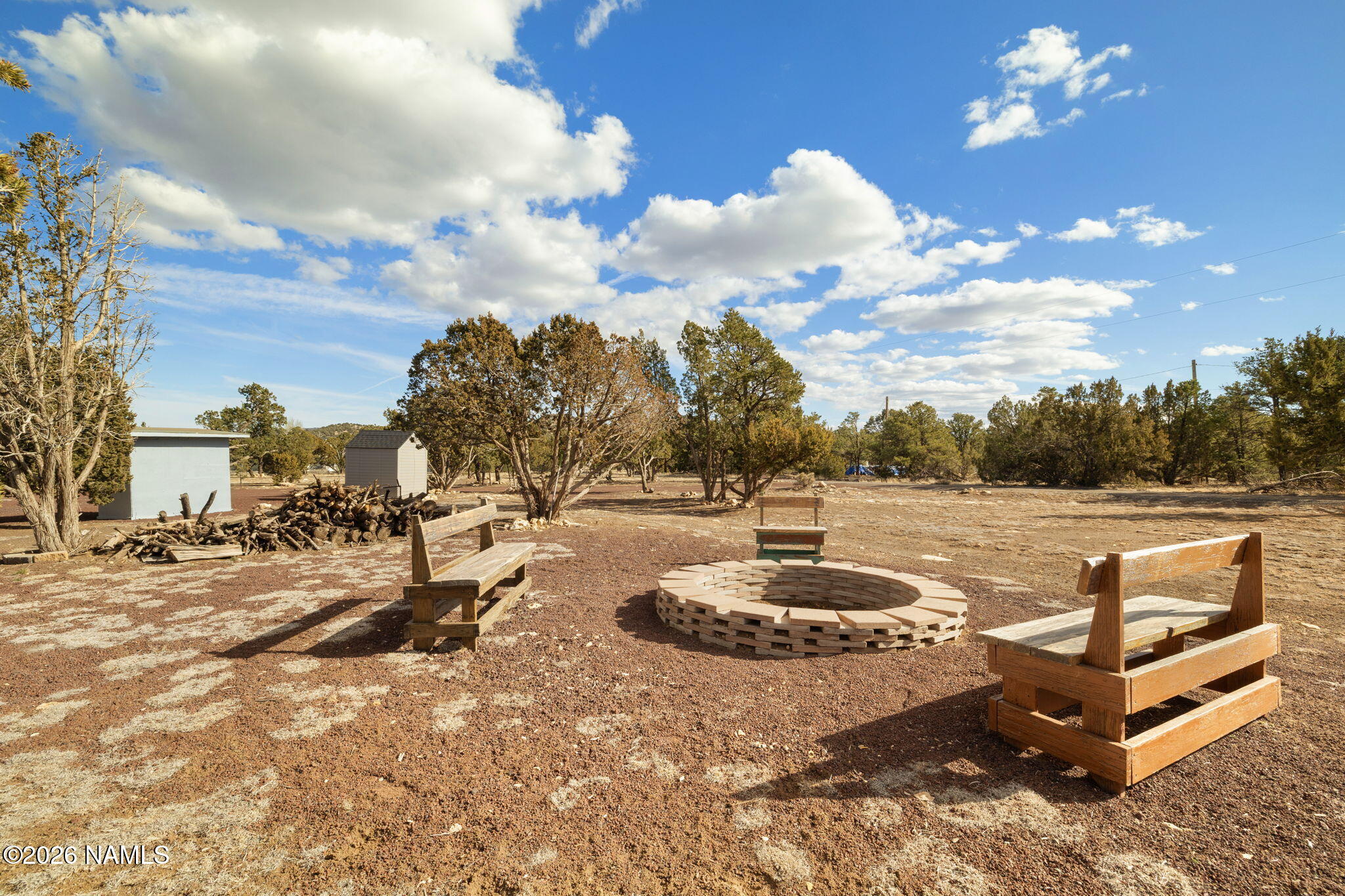 6339 North Bluefield Road Flagstaff, AZ 86004 - Photo 23 of 35 a view of a swimming pool with a yard