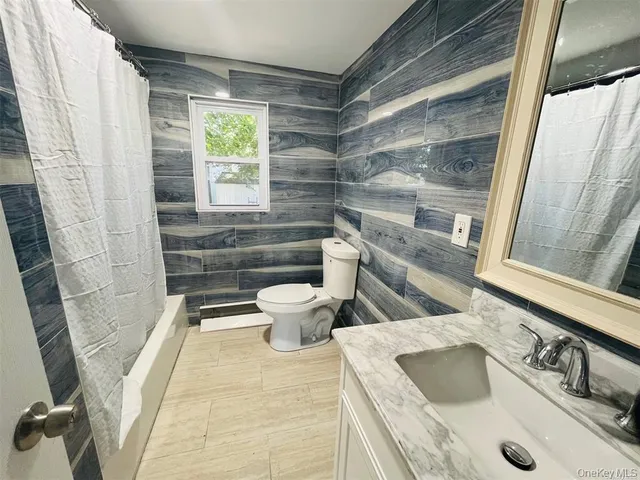 a bathroom with a sink and toilet