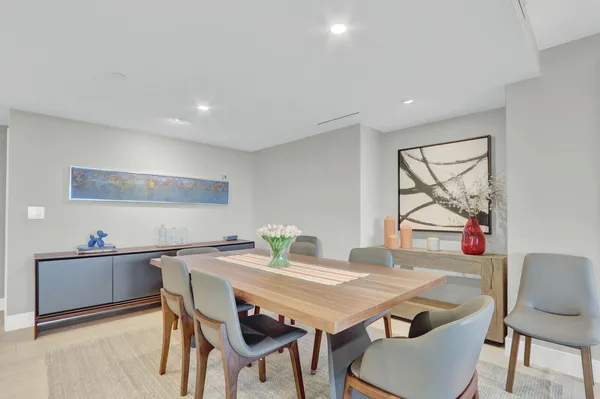 a view of a dining room with furniture and window