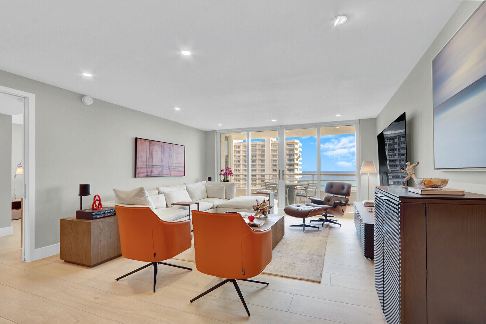 4201 North Ocean Boulevard, Unit C1202 Boca Raton, FL 33431 - Photo 19 of 47 a living room with furniture potted plant and a window