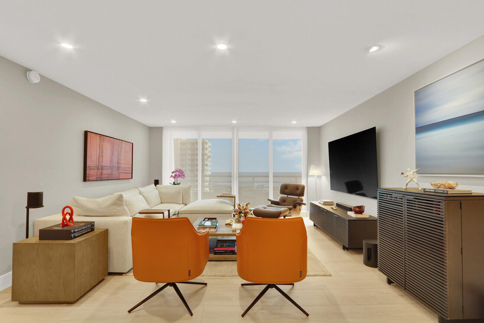 4201 North Ocean Boulevard, Unit C1202 Boca Raton, FL 33431 - Photo 24 of 47 a living room with furniture and a flat screen tv