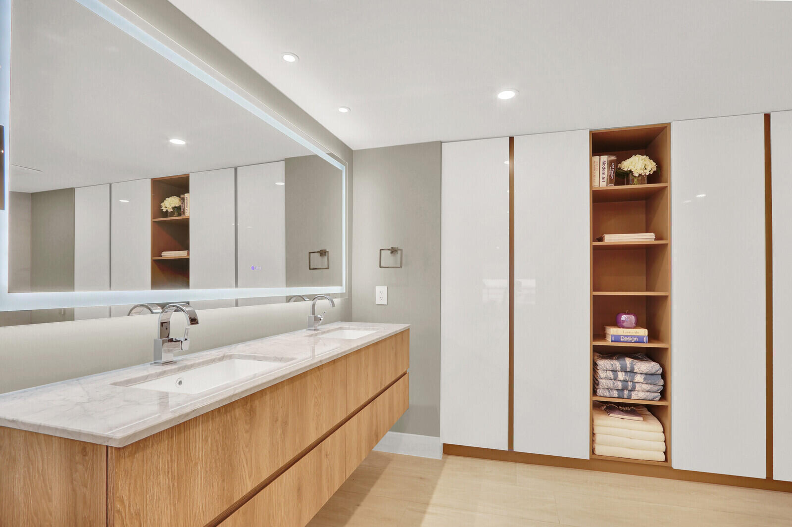 4201 North Ocean Boulevard, Unit C1202 Boca Raton, FL 33431 - Photo 31 of 47 a bathroom with a double vanity sink and mirror