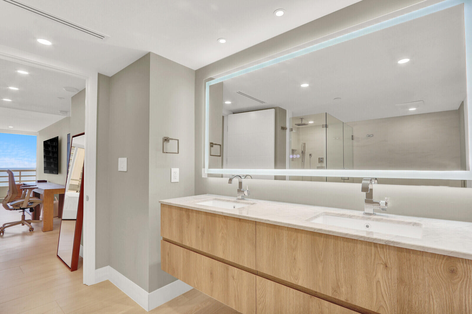 4201 North Ocean Boulevard, Unit C1202 Boca Raton, FL 33431 - Photo 32 of 47 a bathroom with a double vanity sink and a mirror