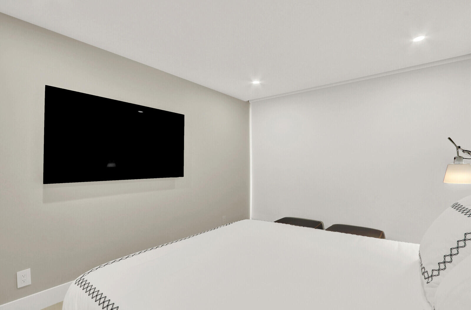 4201 North Ocean Boulevard, Unit C1202 Boca Raton, FL 33431 - Photo 38 of 47 a bedroom with a bed and a flat screen tv