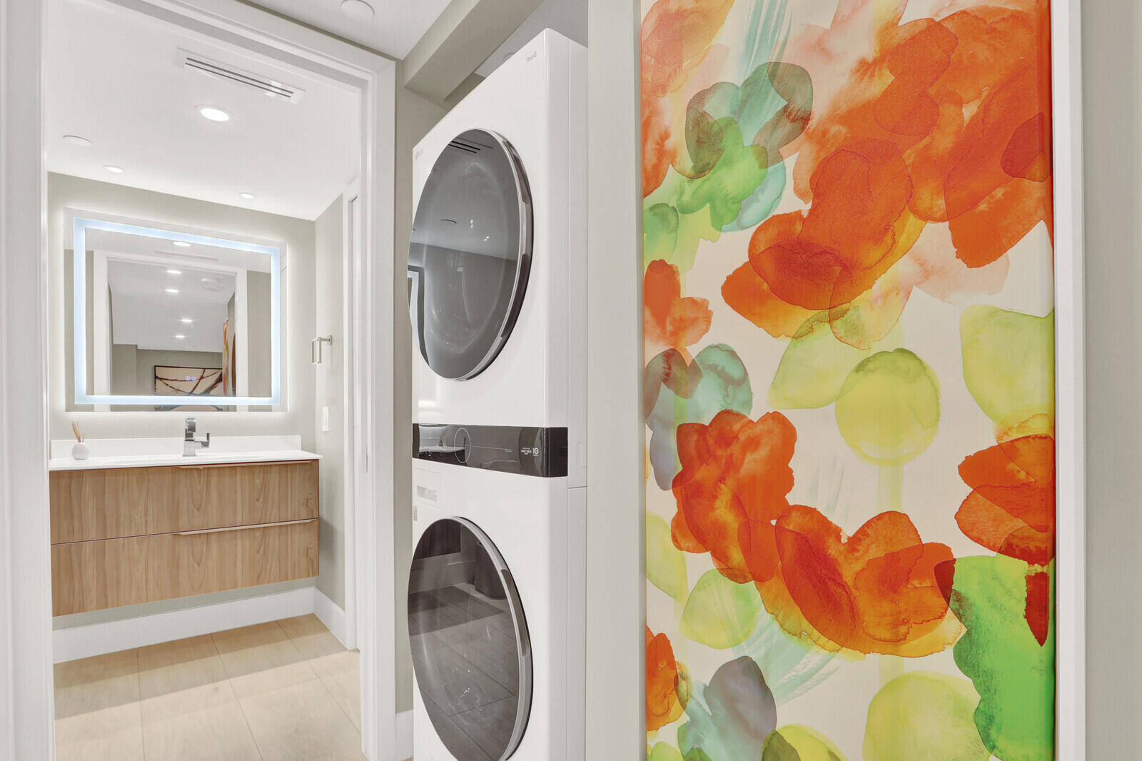 4201 North Ocean Boulevard, Unit C1202 Boca Raton, FL 33431 - Photo 40 of 47 a bathroom with a sink and mirror with bathtub