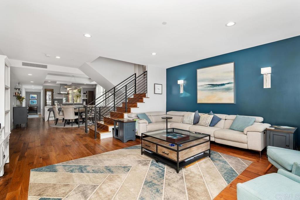 215 2nd Street, Unit 101 Encinitas, CA 92024 - Photo 12 of 47 a living room with furniture and wooden floor