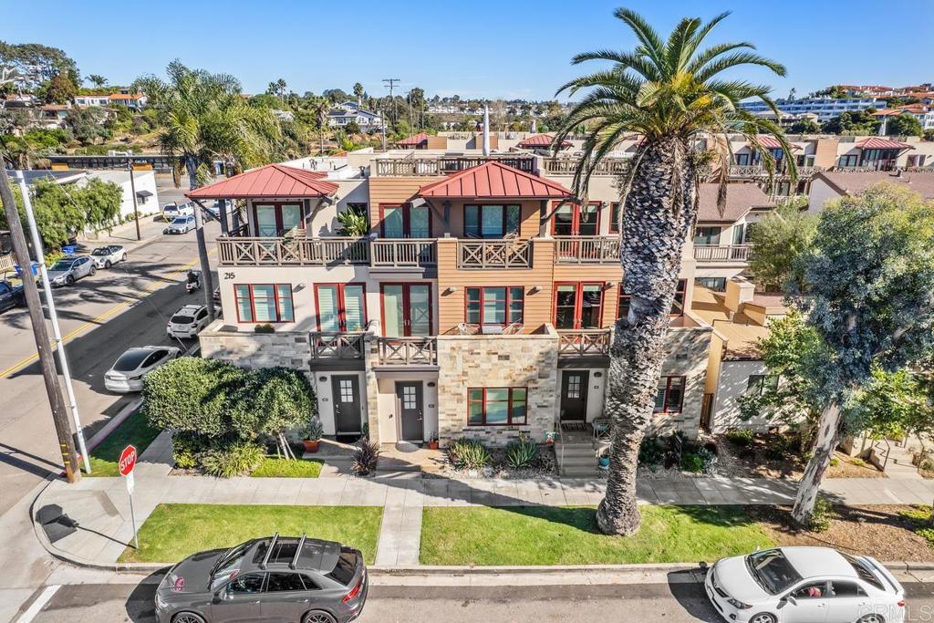 215 2nd Street, Unit 101 Encinitas, CA 92024 - Photo 2 of 47 a swimming pool with outdoor seating and yard