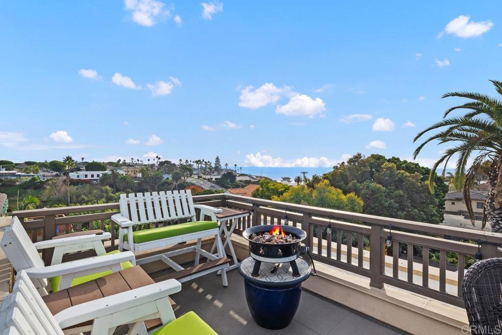 215 2nd Street, Unit 101 Encinitas, CA 92024 - Photo 33 of 47 a view of a chairs and tables in the balcony