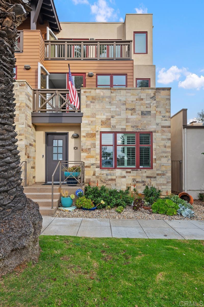 215 2nd Street, Unit 101 Encinitas, CA 92024 - Photo 4 of 47 a front view of a house with garden