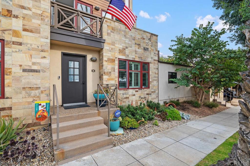 215 2nd Street, Unit 101 Encinitas, CA 92024 - Photo 5 of 47 a front view of a house with plants