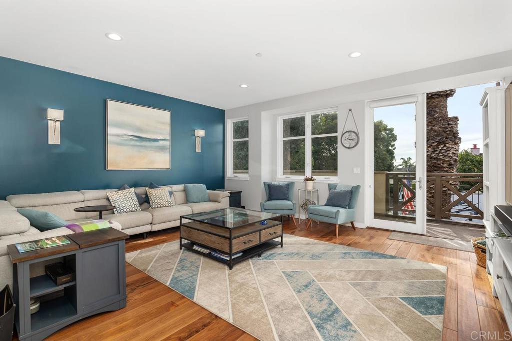 215 2nd Street, Unit 101 Encinitas, CA 92024 - Photo 9 of 47 a living room with furniture and a large window