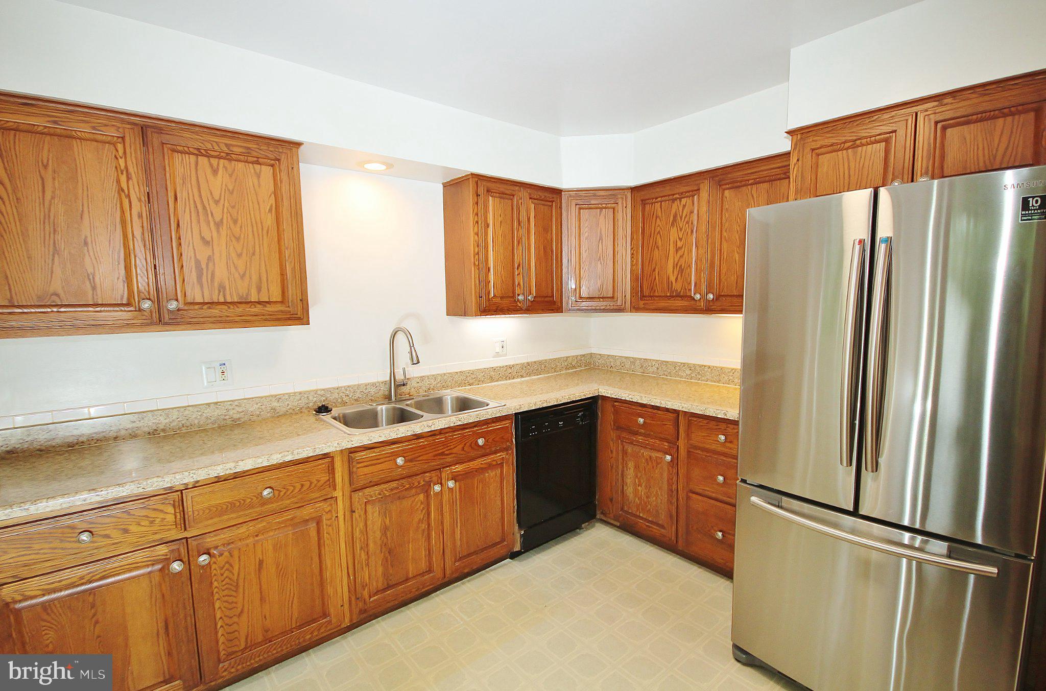 5504 Inverchapel Road Springfield, VA 22151 - Photo 7 of 51 Modern kitchen with warm wood tones.