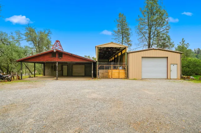 a front view of a house with yard and garage