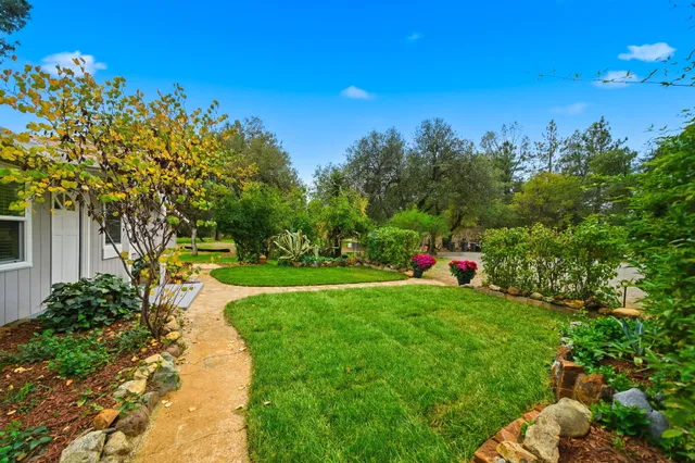 a view of an house with a backyard
