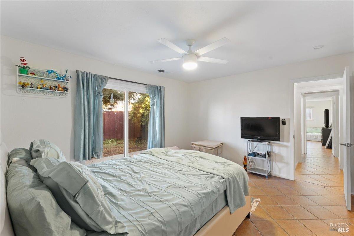 2239 Redwood Road, Unit ABC Napa, CA 94558 - Photo 13 of 20 Sample one of three bedrooms in each house. Each bedroom has a slider to access the back yard/patio. Terra Cotta floors throughout make for easy maintenance. House (A & B Yellow and Green).