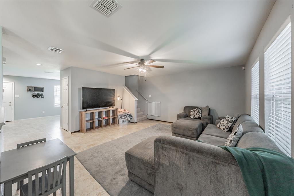 12617 Kingsgate Drive Rhome, TX 76078 - Photo 15 of 39 a living room with furniture and a flat screen tv