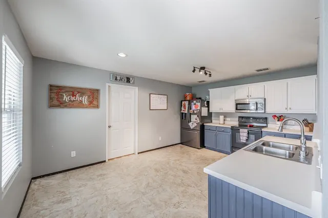 a view of kitchen with furniture and wooden floor