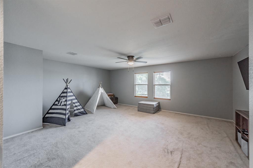 12617 Kingsgate Drive Rhome, TX 76078 - Photo 23 of 39 an empty room with windows
