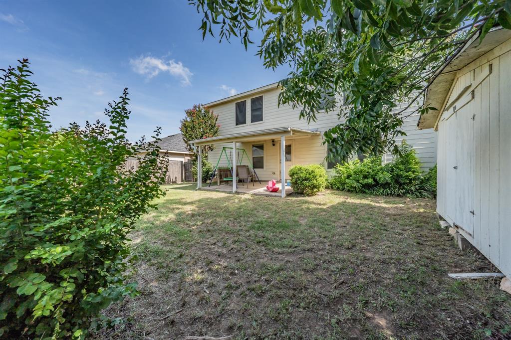 12617 Kingsgate Drive Rhome, TX 76078 - Photo 36 of 39 a view of a house with a yard