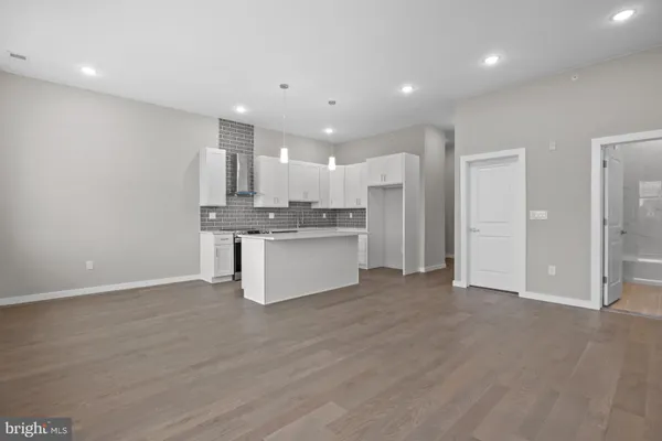 a view of kitchen with wooden floor