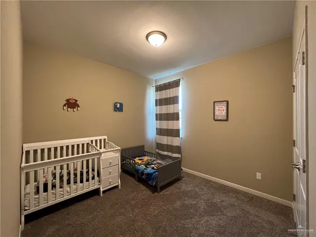 a bed room with a bed and a window