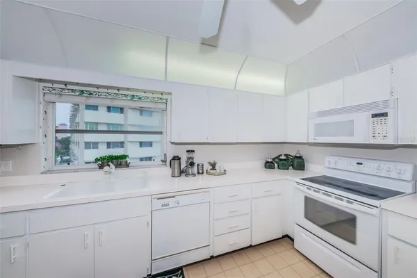 a view of a chairs and table on the garden