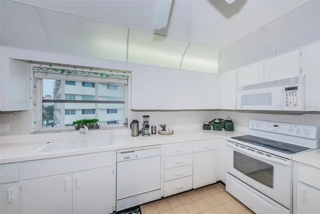 a view of a lake with a table and chairs
