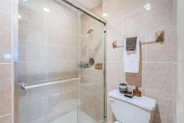 a view of a swimming pool with outdoor seating