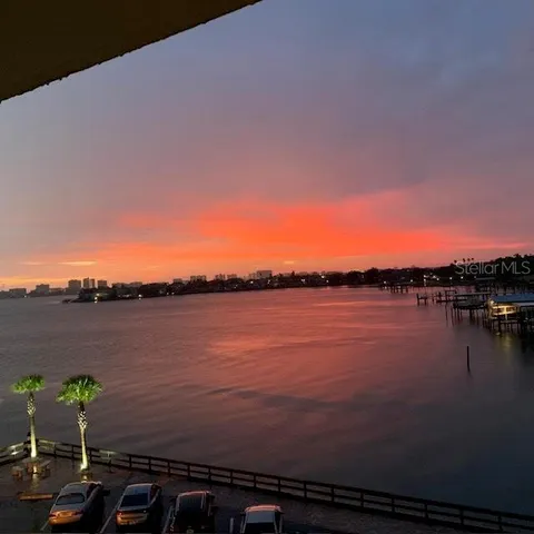 a bedroom with a bed and a chair