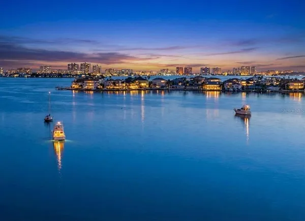 a view of a lake with a city
