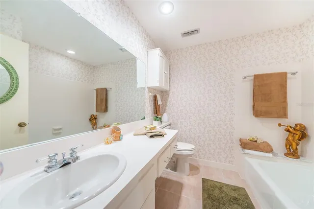 a view of a swimming pool with outdoor seating