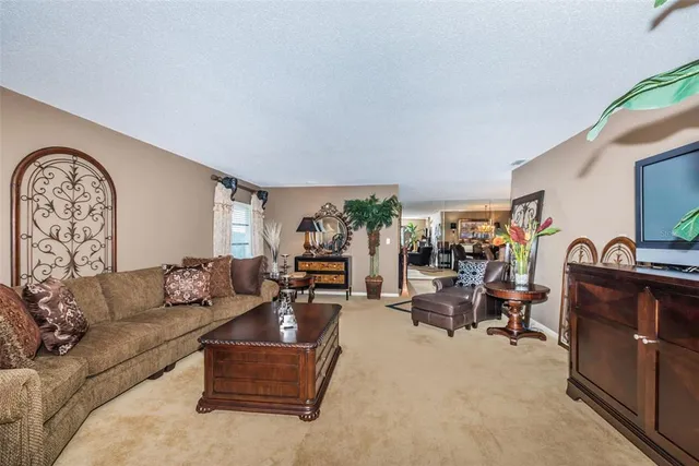 a living room with furniture fireplace and flat screen tv