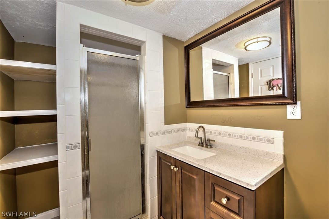 5320 Obannon Road Fort Myers, FL 33905 - Photo 11 of 28 a bathroom with a sink vanity and a mirror