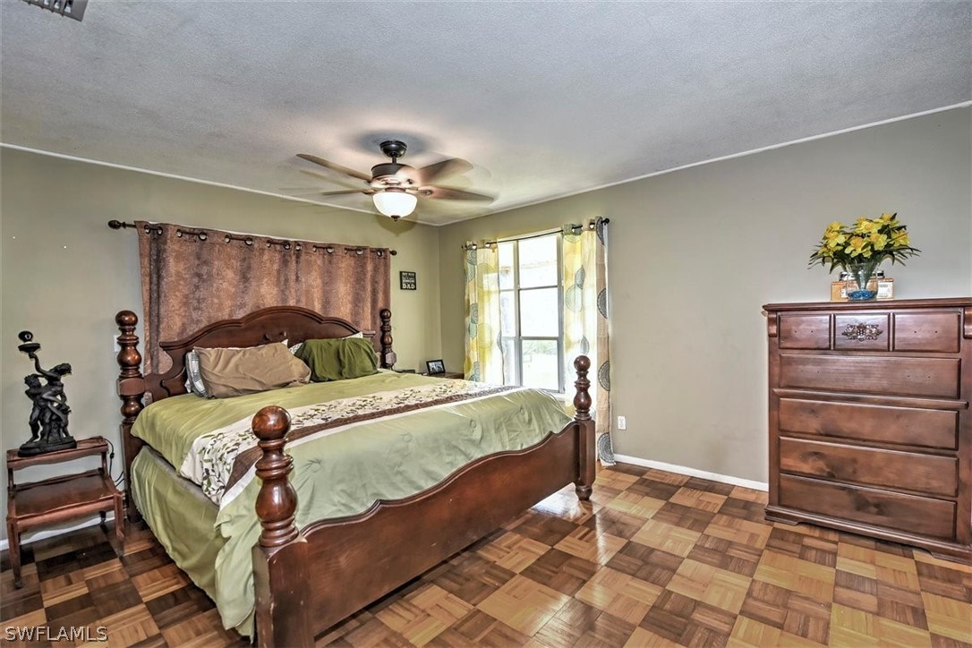 5320 Obannon Road Fort Myers, FL 33905 - Photo 12 of 28 a bedroom with a bed and a closet