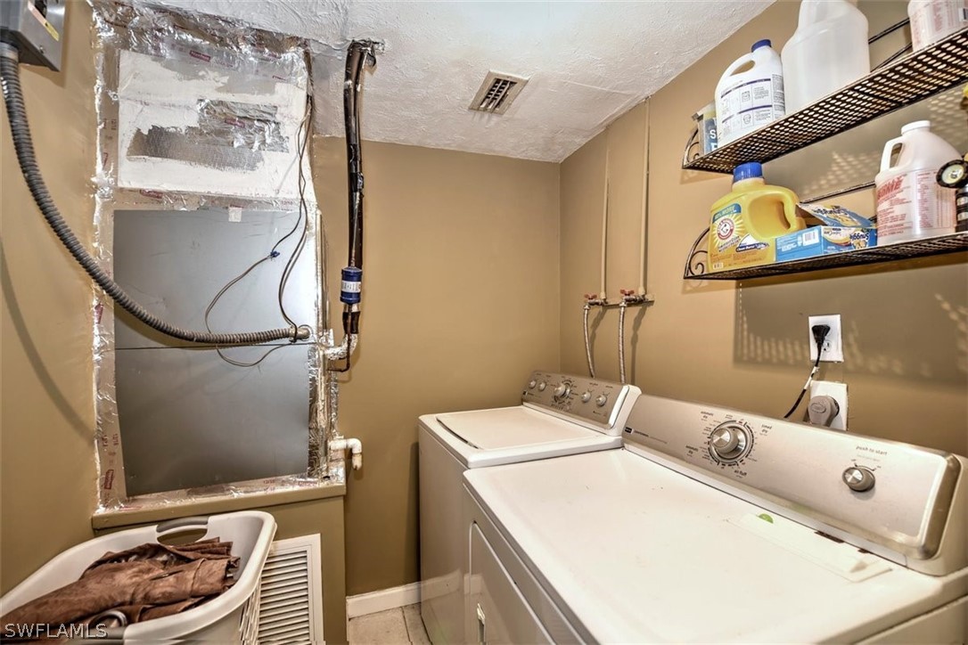 5320 Obannon Road Fort Myers, FL 33905 - Photo 16 of 28 a utility room with dryer and washer