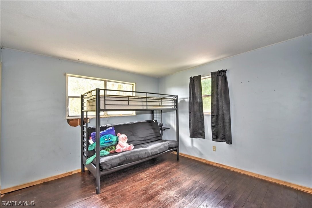 5320 Obannon Road Fort Myers, FL 33905 - Photo 17 of 28 a bedroom with furniture and a window