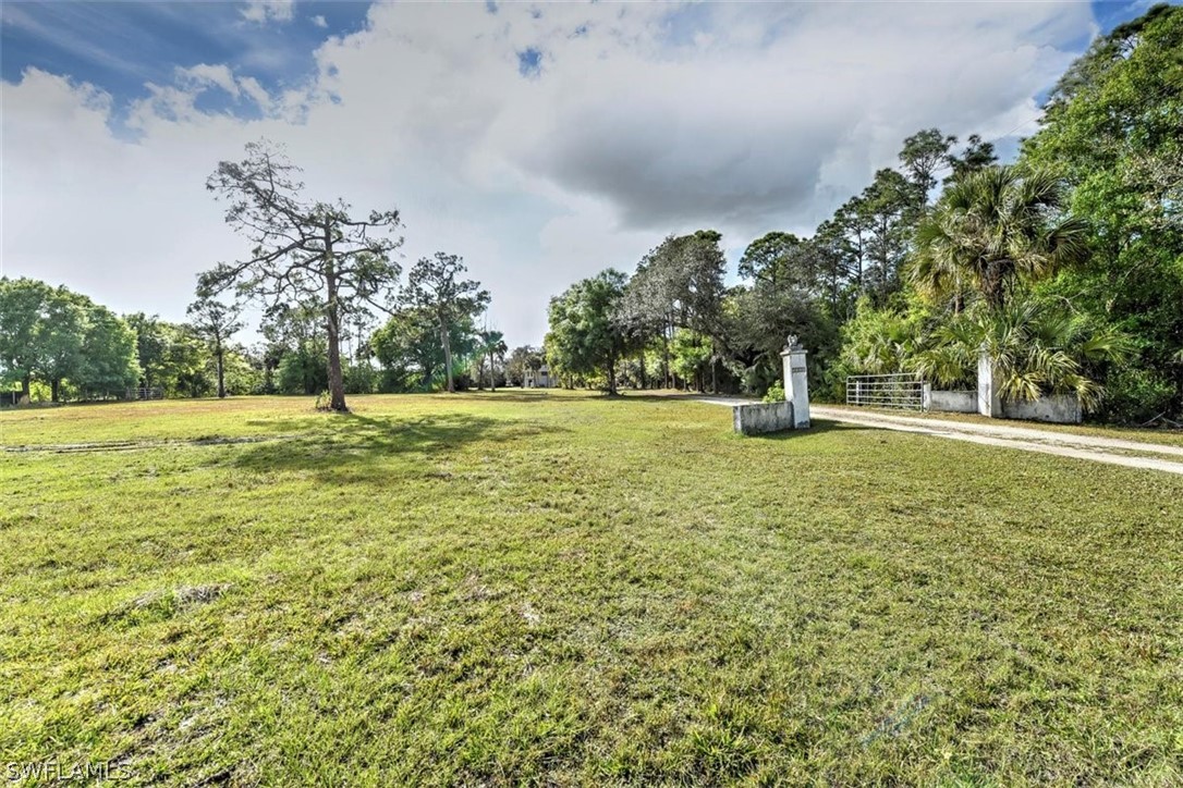 5320 Obannon Road Fort Myers, FL 33905 - Photo 21 of 28 a big yard with lots of green space and palm trees