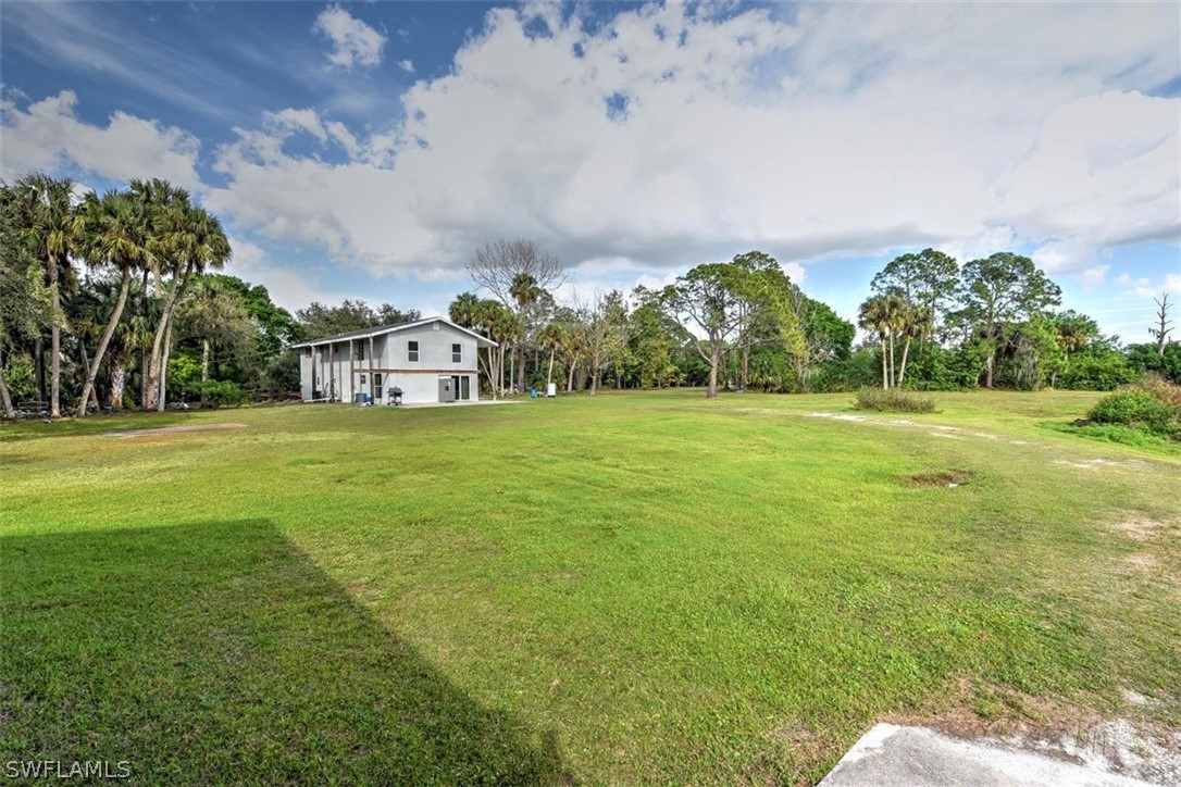 5320 Obannon Road Fort Myers, FL 33905 - Photo 26 of 28 a view of a building with a big yard