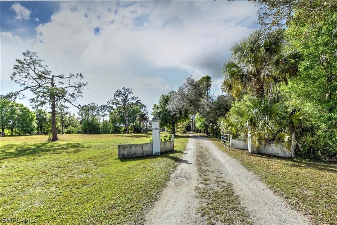 5320 Obannon Road Fort Myers, FL 33905 - Photo 4 of 28 a backyard with tall trees