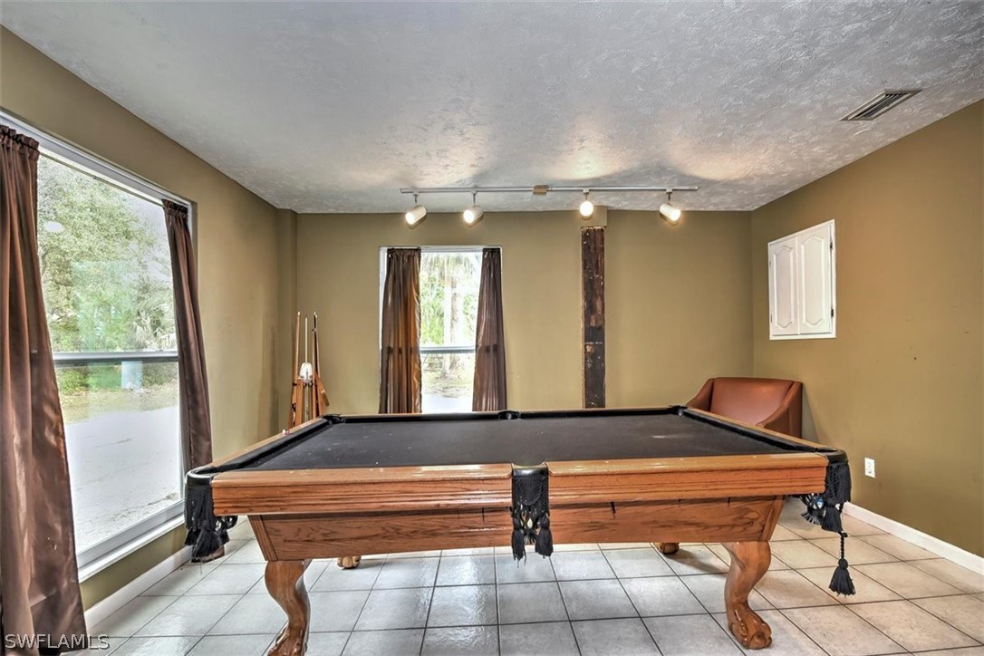 5320 Obannon Road Fort Myers, FL 33905 - Photo 9 of 28 a room with pool table and windows