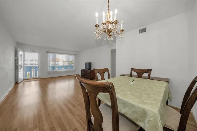 a view of a dining room with furniture and window